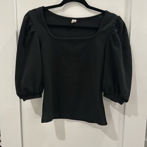 Square neck and puff sleeve blouse in black.